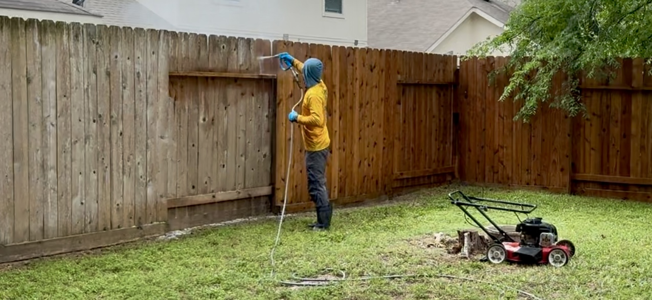 power washing a wooden fence